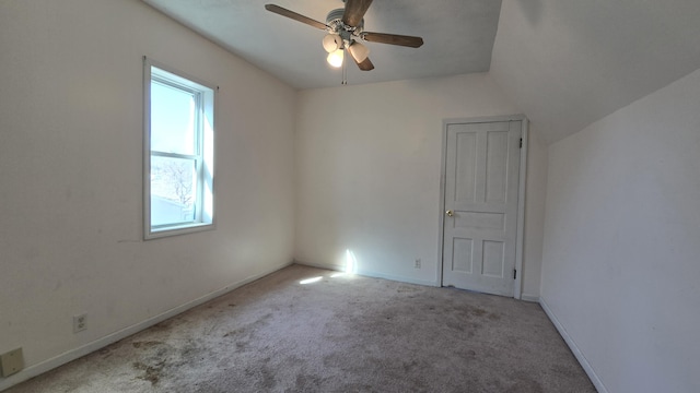 416 S Michigan Ave, Manton, MI 49663 - carpeted spare room featuring plenty of natural light, ceiling fan, and baseboards
