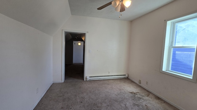 416 S Michigan Ave, Manton, MI 49663 - unfurnished room featuring a baseboard radiator, carpet flooring, a ceiling fan, lofted ceiling, and baseboards