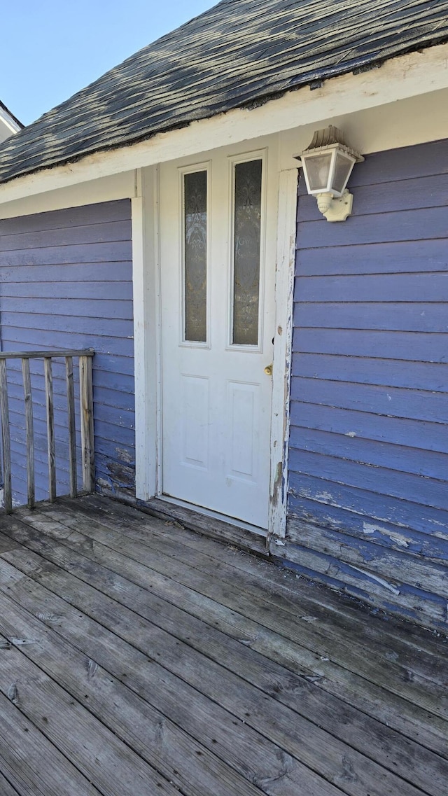 416 S Michigan Ave, Manton, MI 49663 - doorway to property featuring a wooden deck