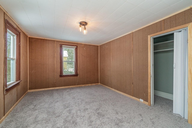 unfurnished bedroom with a closet and light carpet