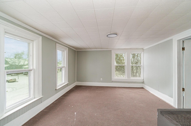 carpeted empty room with ornamental molding