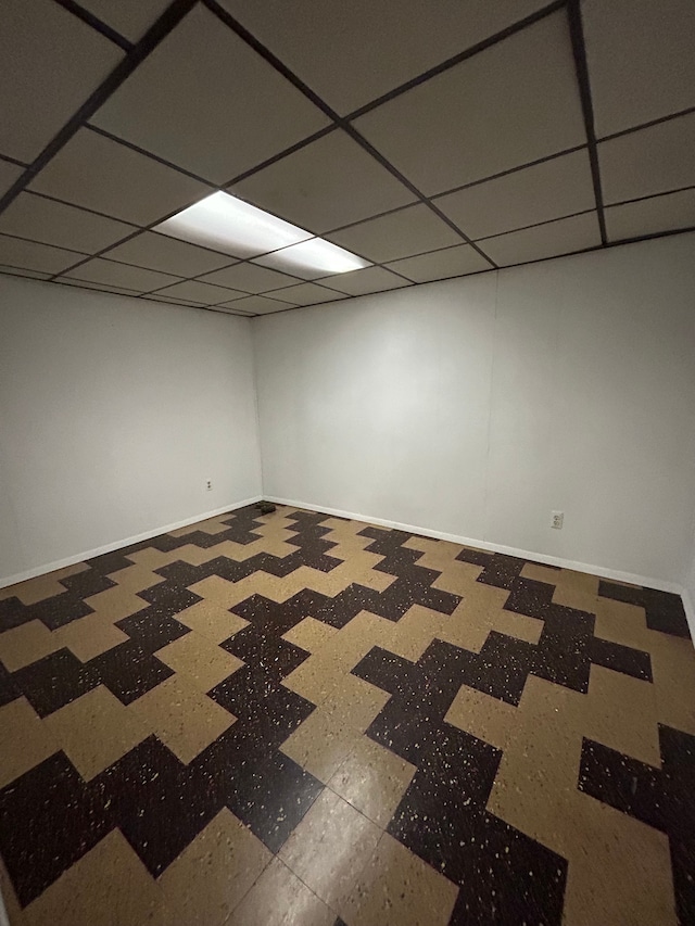 basement featuring a paneled ceiling