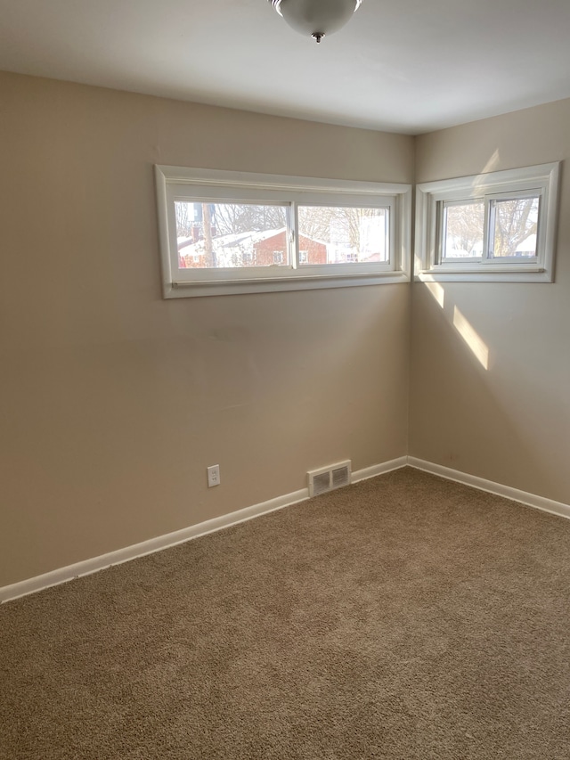 spare room featuring carpet flooring