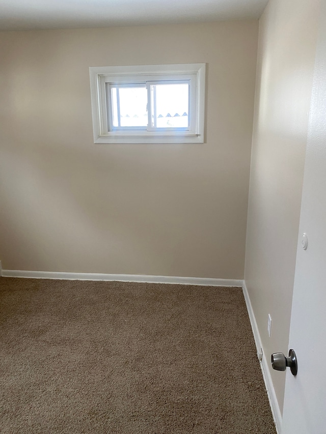 spare room featuring carpet flooring