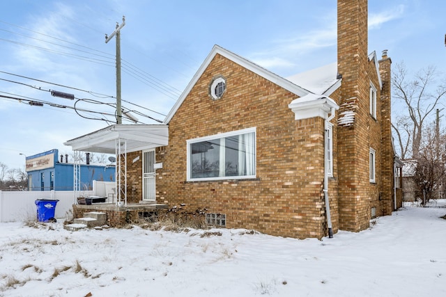 view of snow covered house