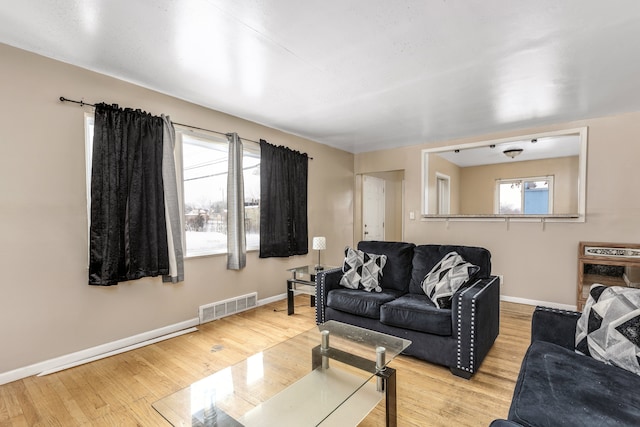 living room with light hardwood / wood-style floors