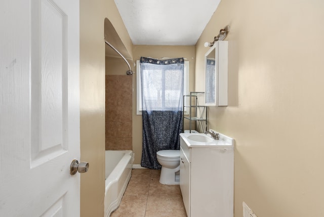 full bathroom with tile patterned flooring, shower / bath combo with shower curtain, vanity, and toilet