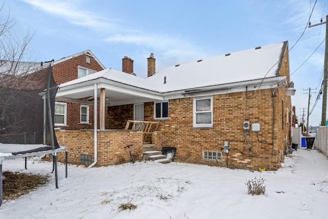 view of snow covered house