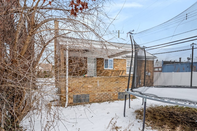 view of snow covered property