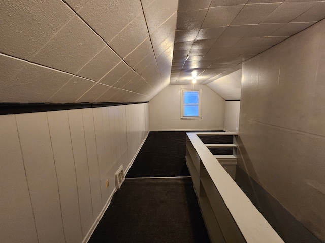 interior space featuring lofted ceiling and visible vents