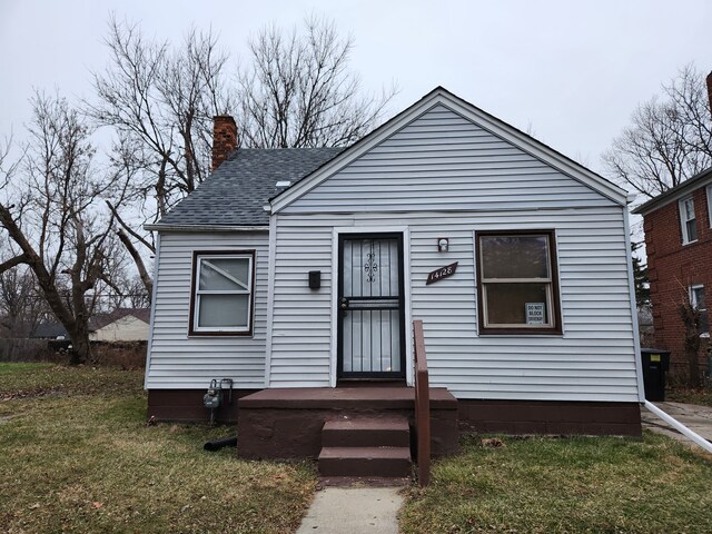 bungalow with a front lawn