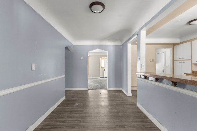 hall featuring dark wood-type flooring