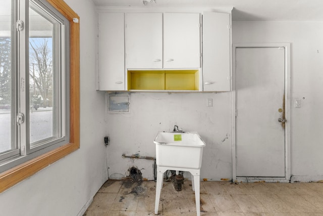 clothes washing area featuring cabinets and hookup for a washing machine