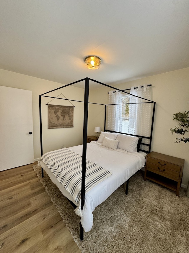 bedroom featuring hardwood / wood-style floors