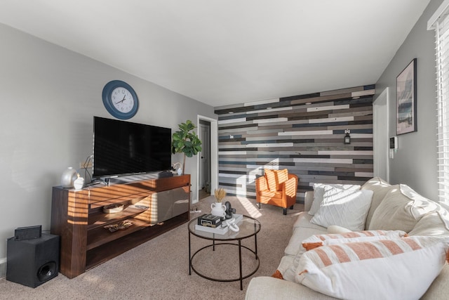 living room featuring carpet floors and wood walls