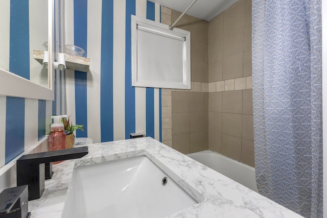 bathroom featuring shower / tub combo with curtain and vanity