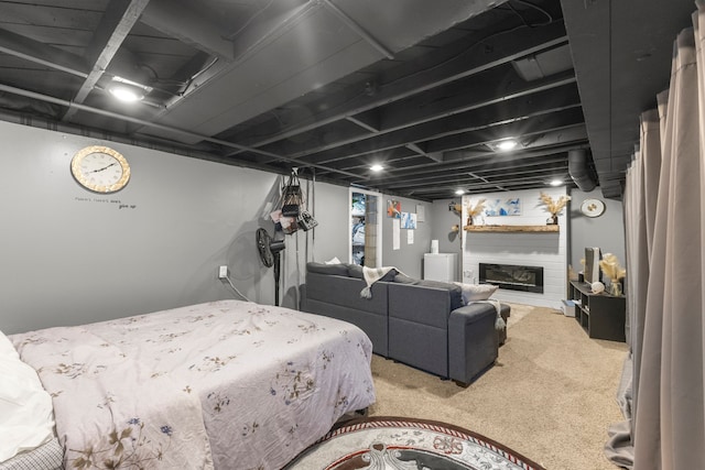 bedroom featuring carpet floors and a fireplace