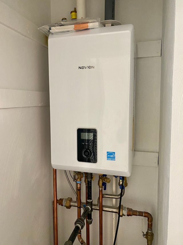 utility room with water heater