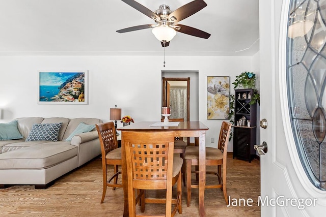 dining space featuring ceiling fan and light hardwood / wood-style flooring