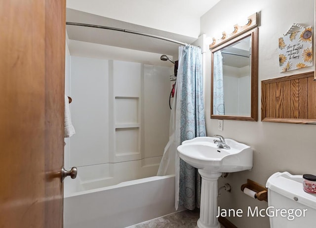 bathroom with toilet and shower / tub combo with curtain