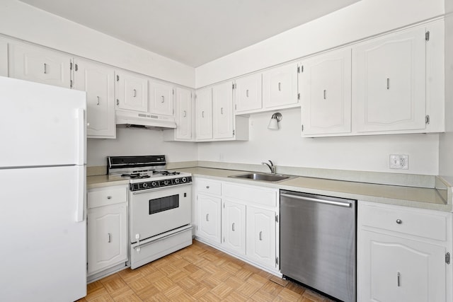 kitchen featuring sink, white appliances, white cabinets, and light parquet flooring