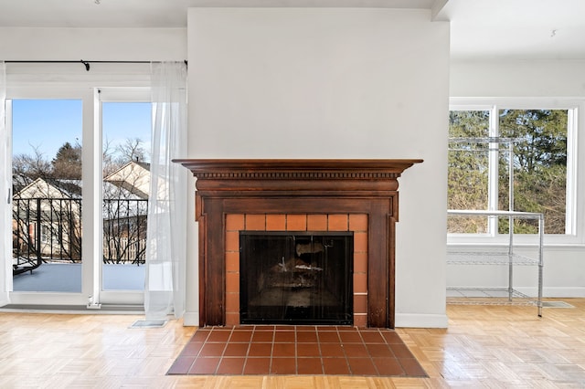 room details with a tiled fireplace and parquet flooring