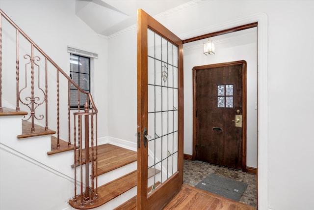 foyer with french doors and hardwood / wood-style flooring