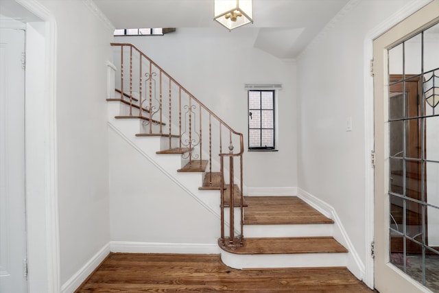 stairway featuring hardwood / wood-style floors