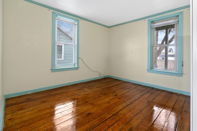 unfurnished room with crown molding and dark hardwood / wood-style floors