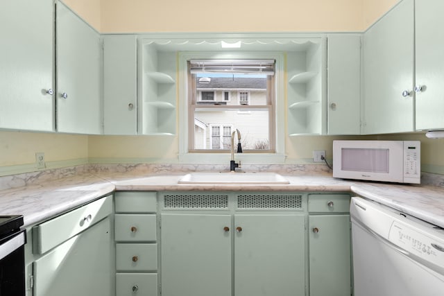 kitchen with sink and white appliances