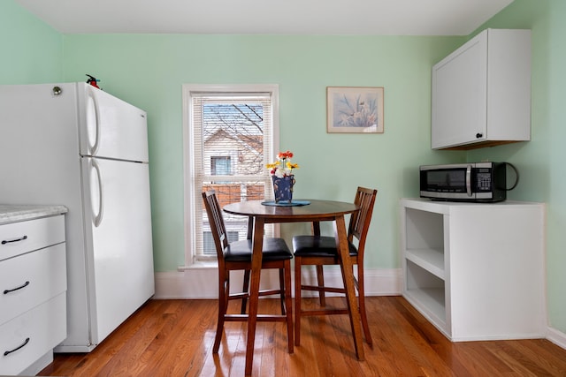 dining space featuring light hardwood / wood-style floors