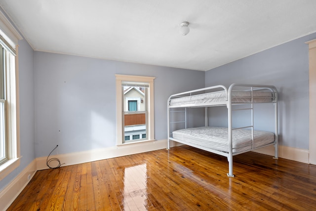 unfurnished bedroom with wood-type flooring