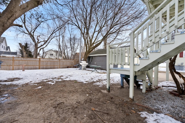 view of yard layered in snow