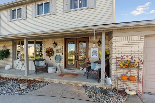 property entrance with french doors and a porch