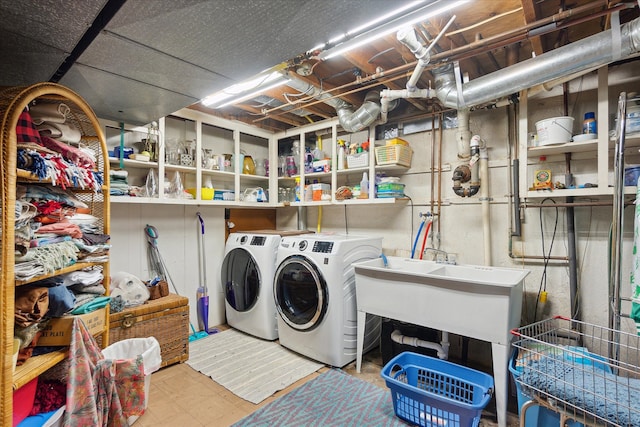 laundry room featuring washer and dryer and sink