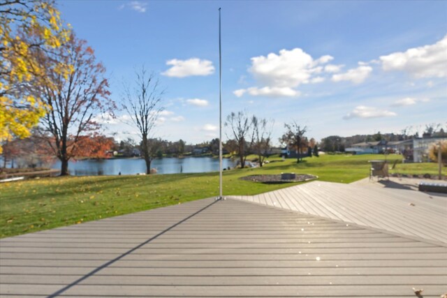 deck featuring a water view and a yard