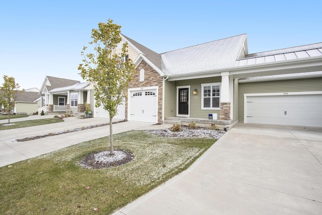 view of front facade with a front yard and a garage