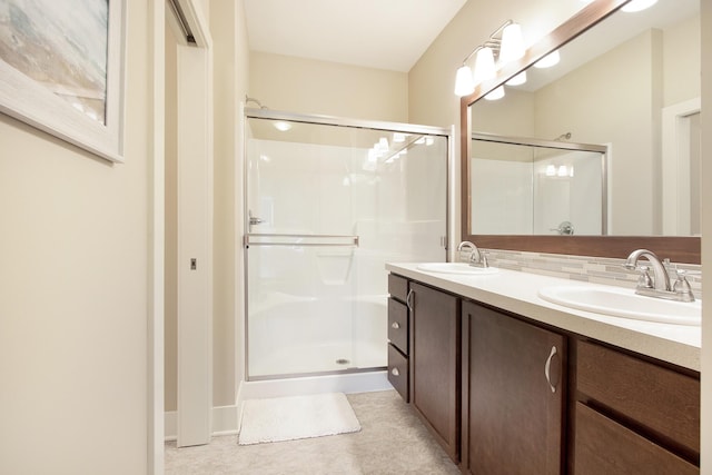 bathroom featuring walk in shower and vanity