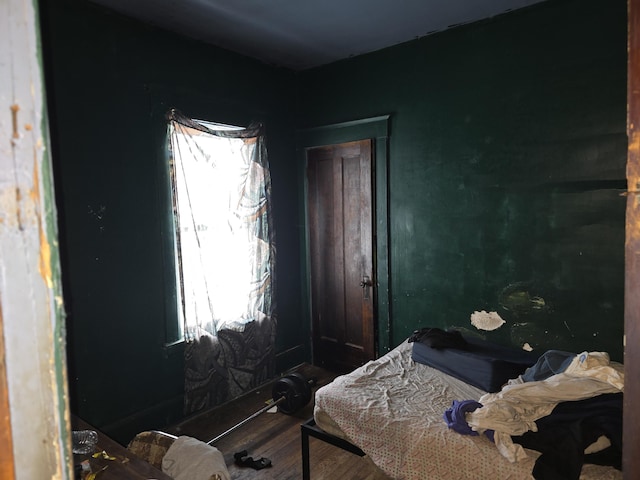 bedroom with wood-type flooring