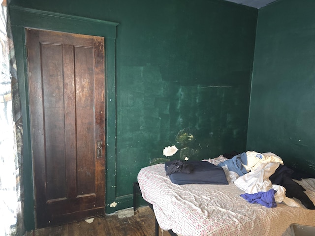 bedroom with wood-type flooring