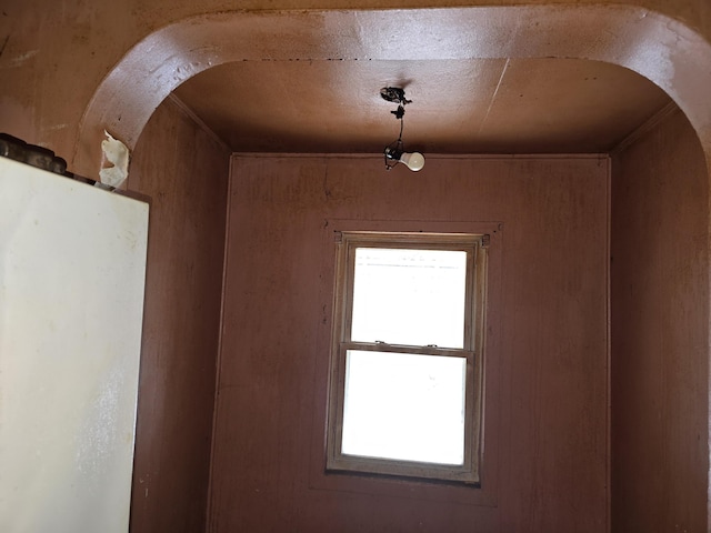 interior space featuring wood walls