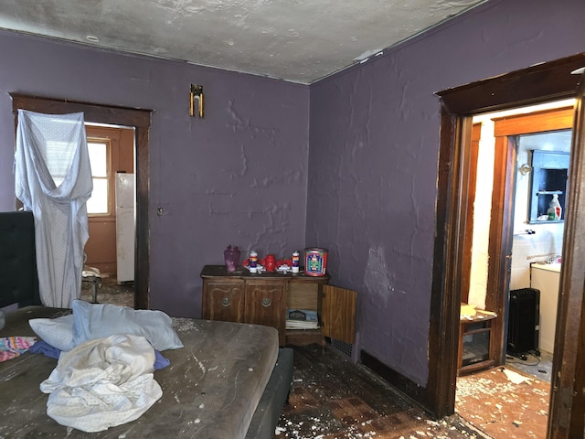 bedroom with white refrigerator