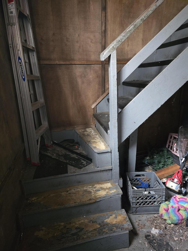 stairway featuring concrete floors