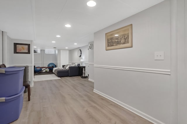 corridor with light hardwood / wood-style floors