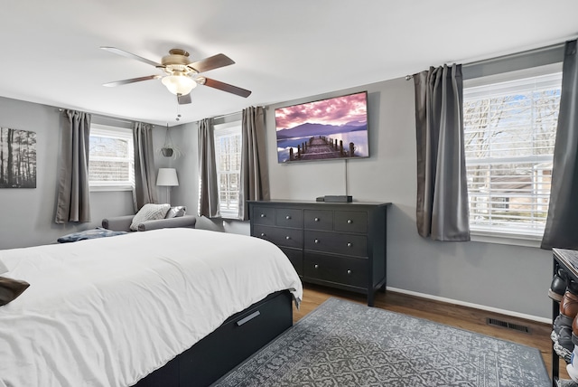 bedroom featuring dark hardwood / wood-style floors and ceiling fan