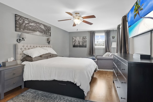 bedroom featuring ceiling fan and dark hardwood / wood-style flooring