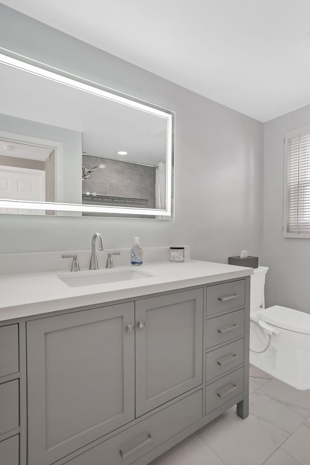 bathroom with vanity, a shower with curtain, and toilet