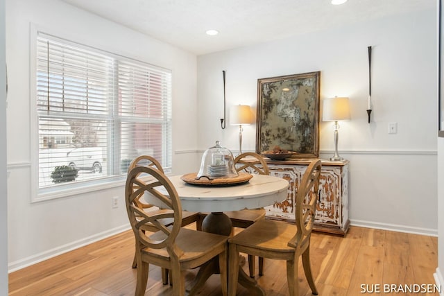 dining space with light wood-type flooring