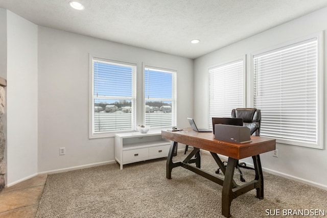 office space with a textured ceiling