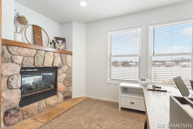 living room featuring carpet flooring and a fireplace